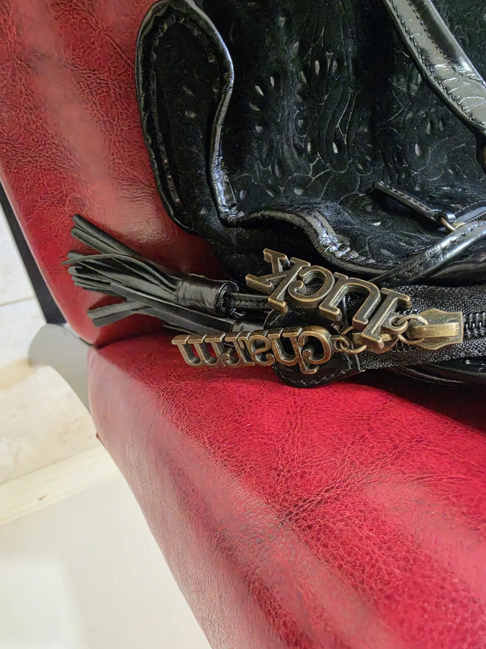 Black Embossed Leather Shoulder Bag with Buckle Pockets